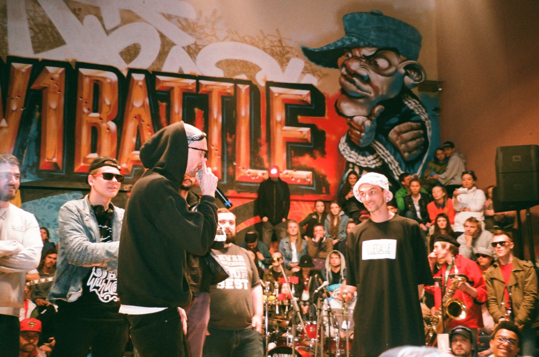 Dynamic scene of a hip hop battle with performers and audience, embodying urban street culture.