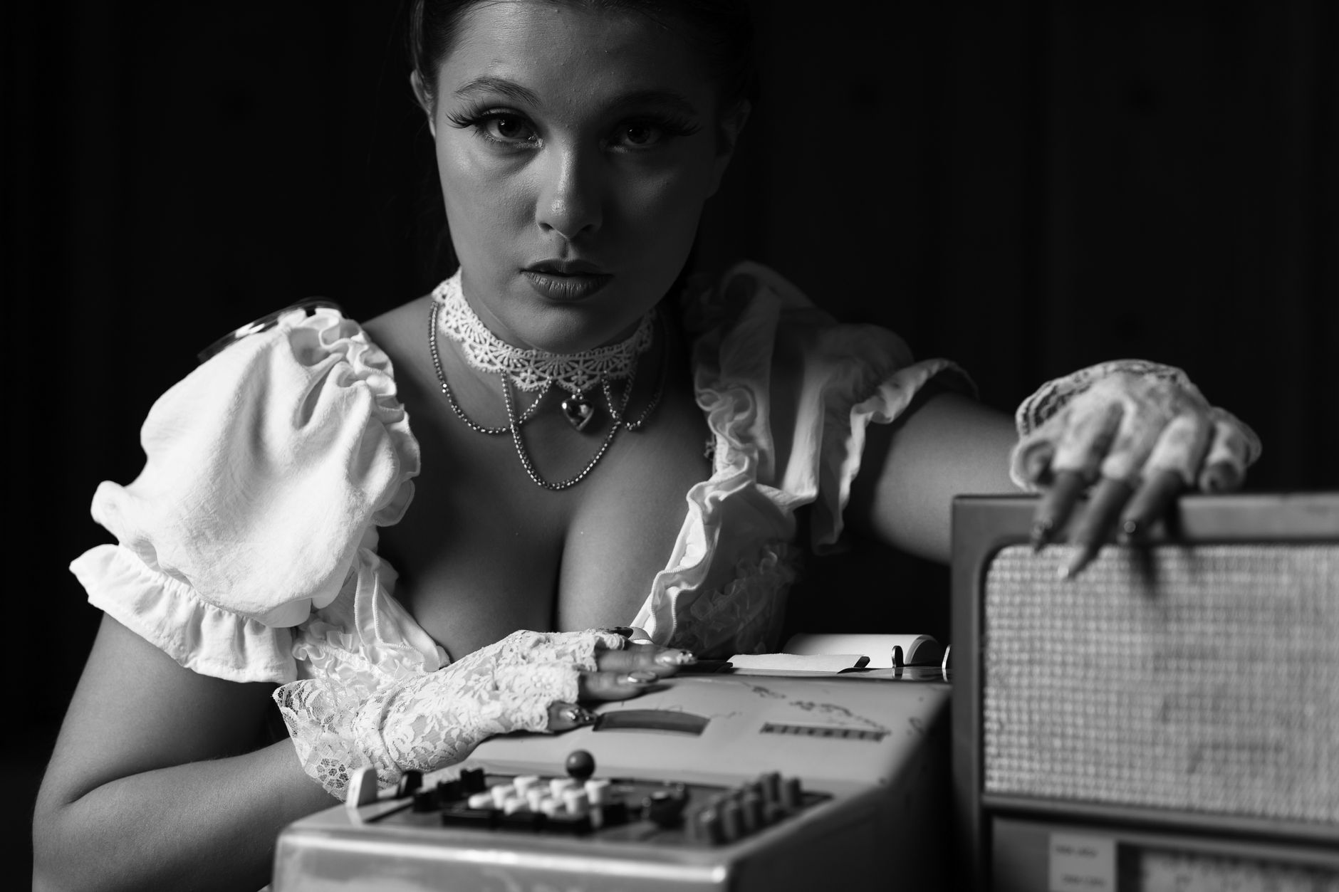Elegant vintage portrait of a model with retro accessories in black and white.