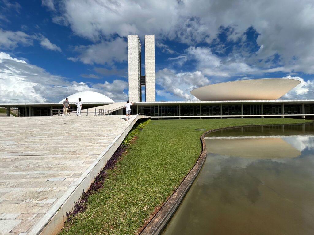 Stunning view of the National Congress of Brazil with its iconic modern architecture under a bright sky.